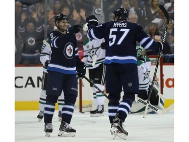 Winnipeg Jets defenceman Jacob Trouba (left) congratulates defenceman Tyler Myers on his power-play goal against the Dallas Stars in Winnipeg on Thurs., Nov. 2, 2017. Kevin King/Winnipeg Sun/Postmedia Network
Kevin King, Kevin King/Winnipeg Sun