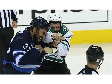 Dallas Stars forward Jamie Benn (right) misses a straight right in a fight with Winnipeg Jets defenceman Dustin Byfuglien in Winnipeg on Thurs., Nov. 2, 2017. Kevin King/Winnipeg Sun/Postmedia Network ORG XMIT: POS1711022119500093
Kevin King, Kevin King/Winnipeg Sun