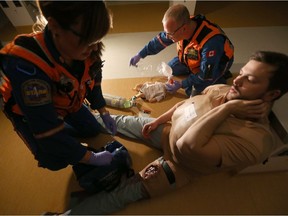 Paramedic pretend to treat victims during a mass casualty training event, in Winnipeg.  Friday, November 10, 2017.   Sun/Postmedia Network
Chris Procaylo, Chris Procaylo/Winnipeg Sun