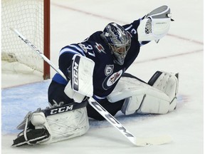 Winnipeg Jets goaltender Connor Hellebuyck pulls down a glove save against the Phoenix Coyotes in Winnipeg on Tues., Nov. 14, 2017. Kevin King/Winnipeg Sun/Postmedia Network
Kevin King, Kevin King/Winnipeg Sun