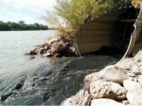 A culvert dumps sewage into the Red River.