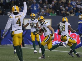Eskimos receiver Brandon Zylstra (centre) celebrates a touchdown during the  West semifinal  against the Blue Bombers in Winnipeg on Sunday. (Kevin King/Winnipeg Sun)