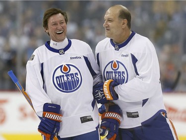 Former Edmonton Oilers forward Dave Semenko (right) died following a battle with pancreatic cancer on Thursday, June 29. He was 59.