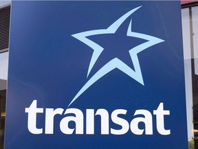 An Air Transat sign is seen Tuesday, May 31, 2016 in Montreal. Passengers trapped aboard two Air Transat jets described hours on end of sweltering heat, a lack of water and the stench of vomit earlier this summer as a federal agency began hearings Wednesday into how their ordeal happened in the first place. THE CANADIAN PRESS/Paul Chiasson ORG XMIT: CPT118

May 31, 2016 file photo