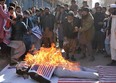 Protesters burn an effigy depicting President Donald Trump during an anti-U.S. and Israeli protest in Quetta on December 7, 2017 following Trump's decision to officially recognise Jerusalem as the Israeli capital.