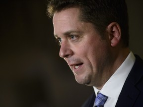 Conservative Leader Andrew Scheer speaks to media in the foyer of the House of Commons on Parliament Hill in Ottawa on Wednesday, Dec. 20, 2017. THE CANADIAN PRESS/Sean Kilpatrick