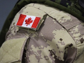 A Canadian flag patch is shown on a soldier's shoulder in Trenton, Ont., on Thursday, Oct. 16, 2014.