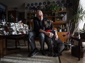 Hans Granholm pictured with his dog Parker in Edmonton, on Thursday. "He just gave his 12th donation," said Granholm.