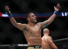 Rafael Dos Anjos celebrates his win over Robbie Lawler in the main event at UFC Fight Night-Lawler vs Dos Anjos in Winnipeg on Saturday night. (THE CANADIAN PRESS)