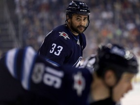 Jets defenceman Dustin Byfuglien will try to shut down Bruins scoring threat Brad Marchand.