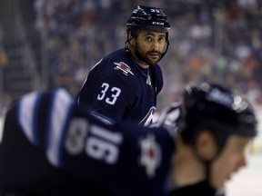Winnipeg Jets' Dustin Byfuglien waits for the puck to be dropped while playing against the Ottawa Senators on Dec. 3, 2017