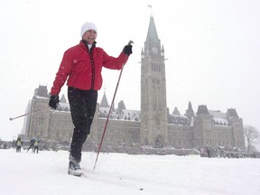 Senator Nancy Greene skies around the front lawn of the Parliament buildings during an event promoting the National Health and Fitness day in Ottawa on February 24, 2016. A bill designed to curtail food and beverage marketing aimed at kids is expected to clear legislative hurdles in the new year as the Liberal government tries to combat rising obesity rates.