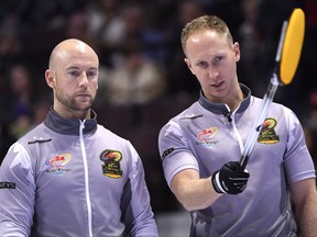 Team Jacobs skip Brad Jacobs talks with third Ryan Fry during a draw against Team Morris at the 2017 Roar of the Rings Canadian Olympic Curling Trials in Ottawa on Saturday, Dec. 2, 2017.