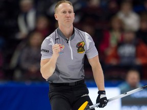 Skip Brad Jacobs pumps his fist after throwing his final stone in the fifth end during Olympic curling trials action against Team Laycock on Dec. 5, 2017