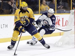 Winnipeg Jets center Adam Lowry (17)'s third line has accounted for 11 goals and 26 points this season.