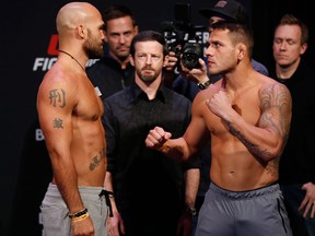Welterweights Robbie Lawler, left, and Rafael Dos Anjos face-off during weigh-in prior to UFC Fight Night in Winnipeg on Dec. 15, 2017