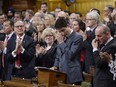 Prime Minister Justin Trudeau wipes his eye while he is applauded while making a formal apology to individuals harmed by federal legislation, policies, and practices that led to the oppression of and discrimination against LGBTQ2 people in Canada, in the House of Commons in Ottawa, Tuesday, Nov.28, 2017. THE CANADIAN PRESS/Adrian Wyld