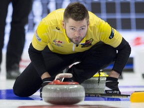 Skip Mike McEwen watches a rock enter the house during the Olympic curling trials on Dec. 6, 2017