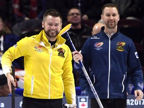 Skip Mike McEwen of Winnipeg, Man., left, and skip Brad Gushue of St. John's N.L. laugh between ends at the men's semifinal at the 2017 Roar of the Rings Canadian Olympic Trials in Ottawa on Saturday, Dec. 9, 2017. (THE CANADIAN PRESS/Justin Tang)
