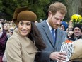 Prince Harry and Meghan Markle arrive at Sandringham, Norfolk, eastern England, on Dec. 25, 2017.