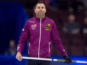 Skip John Morris watches as he slides along the ice between ends during Olympic curling trials action against Team Gushue on Dec. 4, 2017