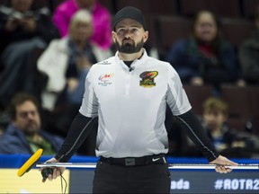 Skip Reid Carruthers from Winnipeg waits for the play to begin in the seventh end during Olympic curling trials action against Team Jacobs, Thursday December 7, 2017 in Ottawa. THE CANADIAN PRESS/Adrian Wyld ORG XMIT: ajw107
