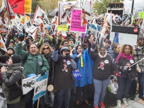 Daycare workers demonstrate during their one-day province-wide strike on Oct. 30, 2017 in Montreal. THE CANADIAN PRESS/Ryan Remiorz