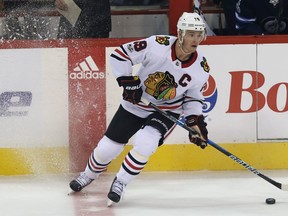 Chicago Blackhawks centre Jonathan Toews puts on the brakes at the centre ice during NHL action against the Winnipeg Jets. (Kevin King/Winnipeg Sun)