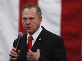 FILE- In this Dec. 11, 2017, file photo, U.S. Senate candidate Roy Moore speaks at a campaign rally in Midland City, Ala.  Moore on Thursday, Dec. 21, pleaded for donations to help him investigate potential election fraud, the same day Alabama officials said they investigated but found nothing improper regarding a TV interview that had raised suspicions.