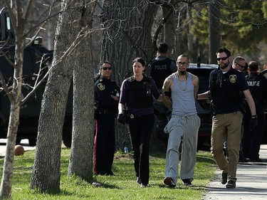 YEAR IN REVIEW: Police take Christopher Brass into custody following a standoff which brought a heavy police presence, including the tactical unit and an armoured vehicle, to the 600 block of Pritchard Avenue in Winnipeg on Tues., May 2, 2017. Kevin King/Winnipeg Sun/Postmedia Network ORG XMIT: POS1705021851562607