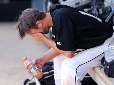 YEAR IN REVIEW: Manitoba's Tristan Peters is disconsolate in the dugout after failing to drive in a run during the Canada Games baseball semi-final against Alberta at Shaw Park in Winnipeg on Thurs., Aug. 3, 2017. Kevin King/Winnipeg Sun/Postmedia Network ORG XMIT: POS1708031936161858