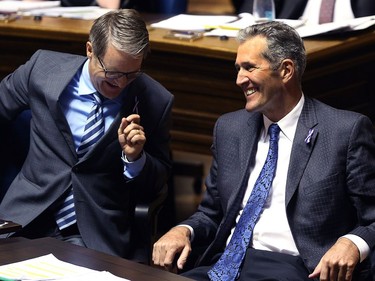 YEAR IN REVIEW: Premier Brian Pallister (right) shares a laugh with finance minister Cameron Friesen during question period at the Manitoba Legislature in Winnipeg on Mon., Oct. 23, 2017. Kevin King/Winnipeg Sun/Postmedia Network ORG XMIT: POS1710231831150233