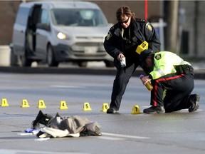 Police are investigating a serious incident on Main Street, in Winnipeg.  Appears as though a pedestrian was struck by a vehicle. Friday, December 01, 2017.   Sun/Postmedia Network