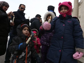 Candles are lit during a vigil for the victims of a terrorist attack in Peshawar, Pakistan on Friday, at the Manitoba Legislative Building in Winnipeg on Sun., Dec. 3, 2017. Kevin King/Winnipeg Sun/Postmedia Network