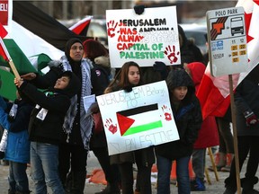 Palestinian-Canadians and supporters protest U.S. President Donald Trump's recent declaration of Jerusalem as the capital of Israel, on Portage Avenue near Polo Park Shopping Centre, on Sunday.