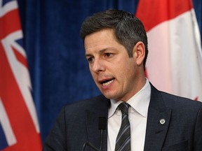 Mayor Brian Bowman speaks in the press room at City Hall in Winnipeg on Monday.