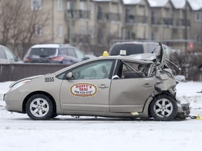 A two vehicle crash close a major intersection in Winnipeg today.  A large pick up truck collided with a taxi cab.   Wednesday, December 13, 2017.   Sun/Postmedia Network