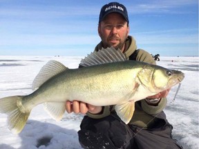 Don Lambert of St. Malo with fish caught ice-fishing on Lake Winnipeg.