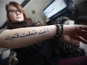 Kristen Hiebert, who almost died in a car crash in January, 2016, shows her Arabic tattoo which she says is translated "I lived, I suffered, I changed" as she is photographed in her home in Boissevain, Manitoba, Thursday, November 16, 2017. Almost two years after the crash, the 28-year-old continues to adapt to life without her lower legs - amputated due to frostbite - and continues to work to build a better life for herself and her daughter Avery, now 6.