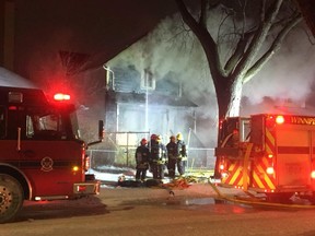 Winnipeg Fire Paramedic Service crews attend to a house fire in the 400 block of Flora Avenue that broke out at around 7 a.m. on Sunday.