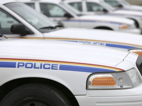 RCMP cruisers line the parking lot at the Airdrie RCMP Detachent on Friday May 15, 2015 in Airdrie, Alta. Britton Ledingham/Airdrie Echo/Postmedia Network