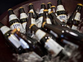 Miller Lite beer bottles sit on ice at an Advertising Specialty Institute company holiday party December 14, 2017 in Trevose, Pennsylvania.