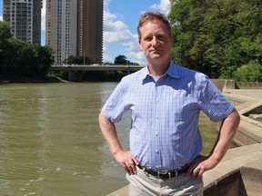 NDP environment critic Rob Altemeyer stands near the river behind the Manitoba Legislature on Friday, Aug. 11, 2017. Altemeyer says a project that could send U.S. water into Manitoba's waterways raises plenty of questions and concerns. JOYANNE PURSAGA/Winnipeg Sun