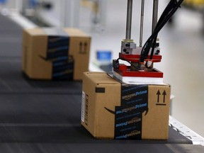 Product is automatically labelled along the conveyor inside the Amazon Fulfillment Centre in Brampton on Friday July 21, 2017.