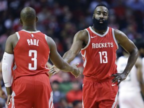 Houston Rockets guard James Harden shakes hands with Chris Paul on Dec. 16, 2017
