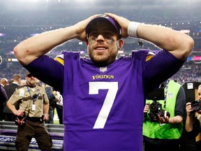 Quarterback Case Keenum of the Minnesota Vikings celebrates as he walks off the field after the Vikings defeated the New Orleans Saints 29-24 to win the NFC divisional round playoff game at U.S. Bank Stadium on January 14, 2018 in Minneapolis, Minnesota. (Jamie Squire/Getty Images)