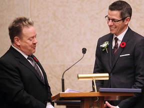 Mayor Brian Bowman (r) takes the oath of office from City Clerk Richard Kachur in Winnipeg, Man. Tuesday November 04, 2014.  Brian Donogh/Winnipeg Sun/QMI Agency