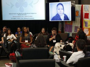 The family of Nicole Daniels speaks to commissioner Michelle Audette at the opening day of hearings at the National Inquiry into Missing and Murdered Indigenous Women and Girls in Winnipeg, Monday, October 16, 2017. The inquiry into missing and murdered Indigenous women and girls has lost its executive director for the second time.