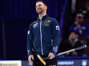 Skip Brad Gushue reacts after his throw in the fourth end during the men's semifinal against Team McEwen at the 2017 Roar of the Rings on Dec. 9, 2017