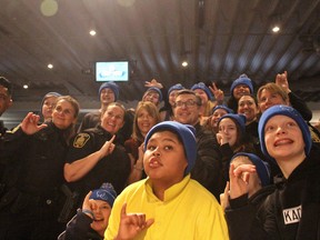 Keynote speakers Theo Fleury (middle right) and Leah Parsons (middle left) are surrounding by students and Winnipeg police officers at the Youth Matter Wellness Conference at Springs Church on Wednesday. Scott Billeck/Winnipeg Sun